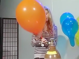 Girls inflate balloons pop to blow...