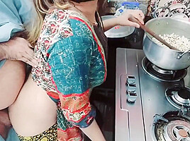 Punjabi maid busy in cooking while...