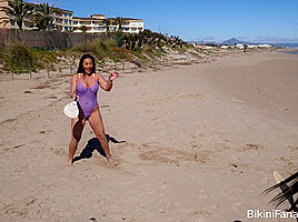 Bikini amateurs playing beach tennis...