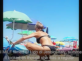 Hot topless milf at jesolo beach...