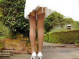Tan stockings with pleated a windy...