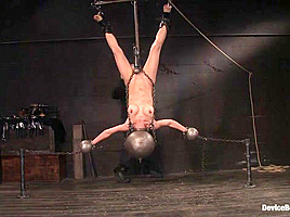In inverted, suspended, tortured, as her...