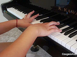 Brunette hottie eaten by her piano...
