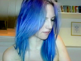 Blue haired girl plays with tits...