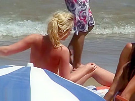 Topless teens showing young firm beach...