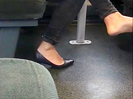 Candid heels dangling on train...
