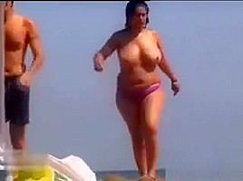 Thick Woman Wth Big Breasts At A Beach