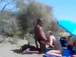Cuckold wife at a beach with...