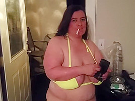 Sexy wife smoking in her bikini...