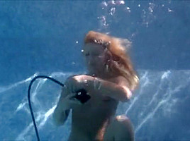 Sunny nude scuba diving...
