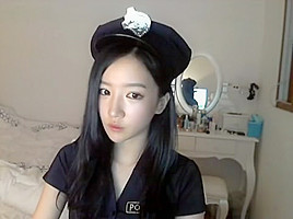 Girl in police cosplay stripteasing...