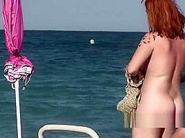 Naked amateur beach nudists sunbathing...