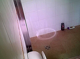 Girl pees while showering voyeur...