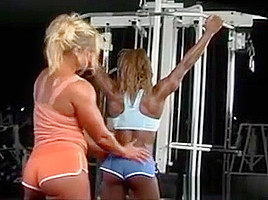 Lesbian bodybuilders flex at the gym...