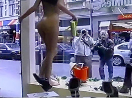 Nude girl washing windows in public...