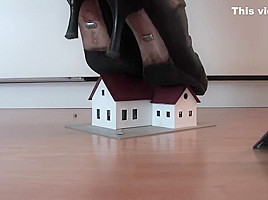 Model railway houses under sexy boots...